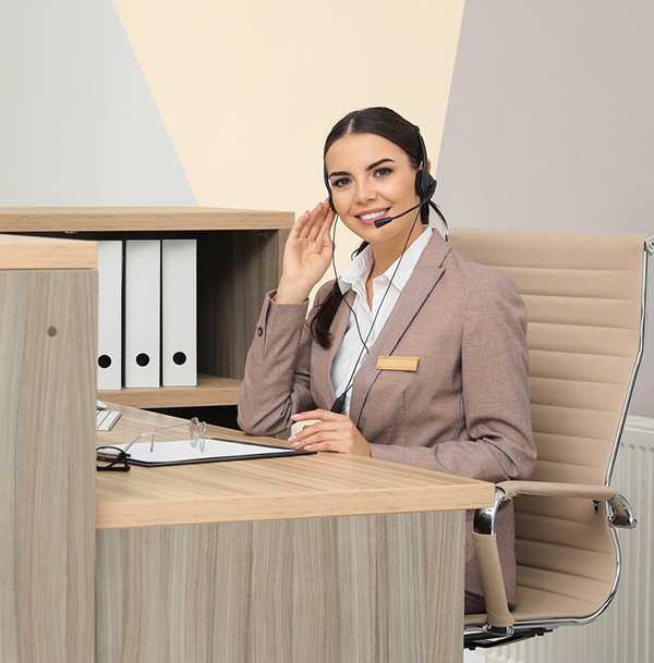 Receptionist sitting at the front desk