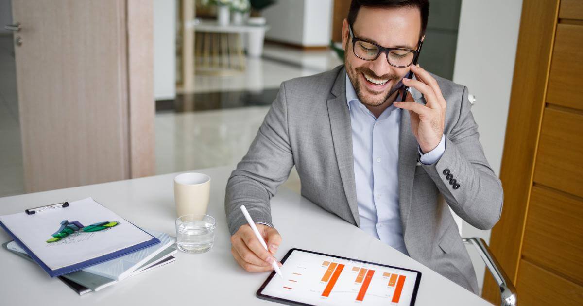 manager looking at increased productivity chart while smiling