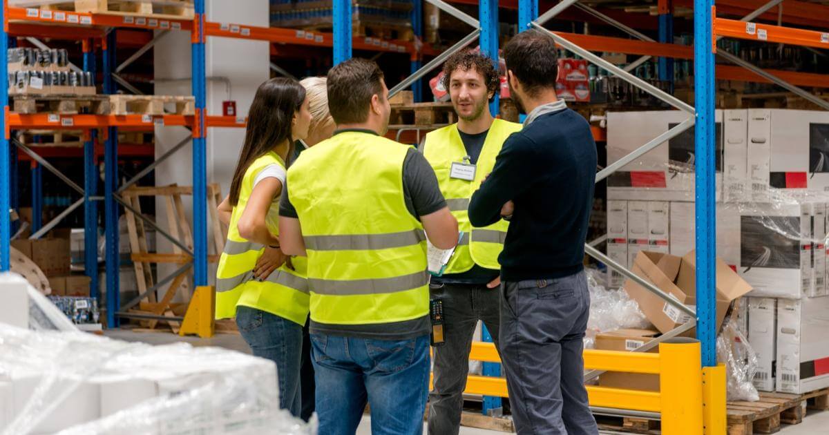 onsite staffing manager in warehouse meeting